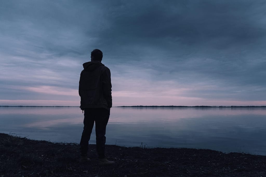 He's in Love With His Ex: 9 Subtle Clues 2 man alone looks out over the water