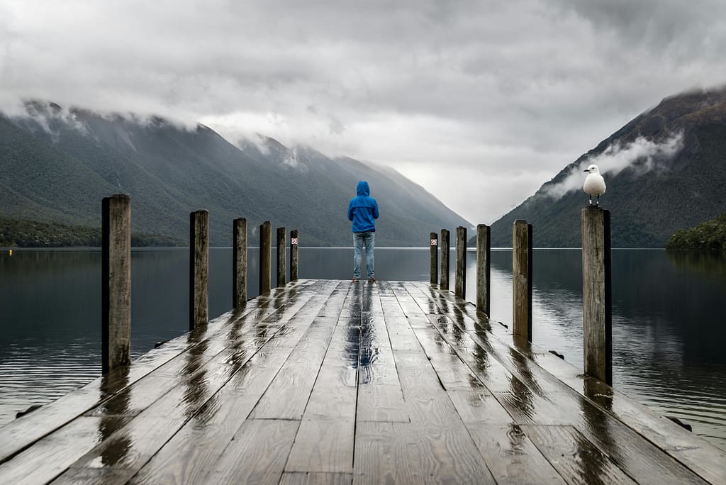 He's in Love With His Ex: 9 Subtle Clues 11 man at the end of a dock on a foggy day