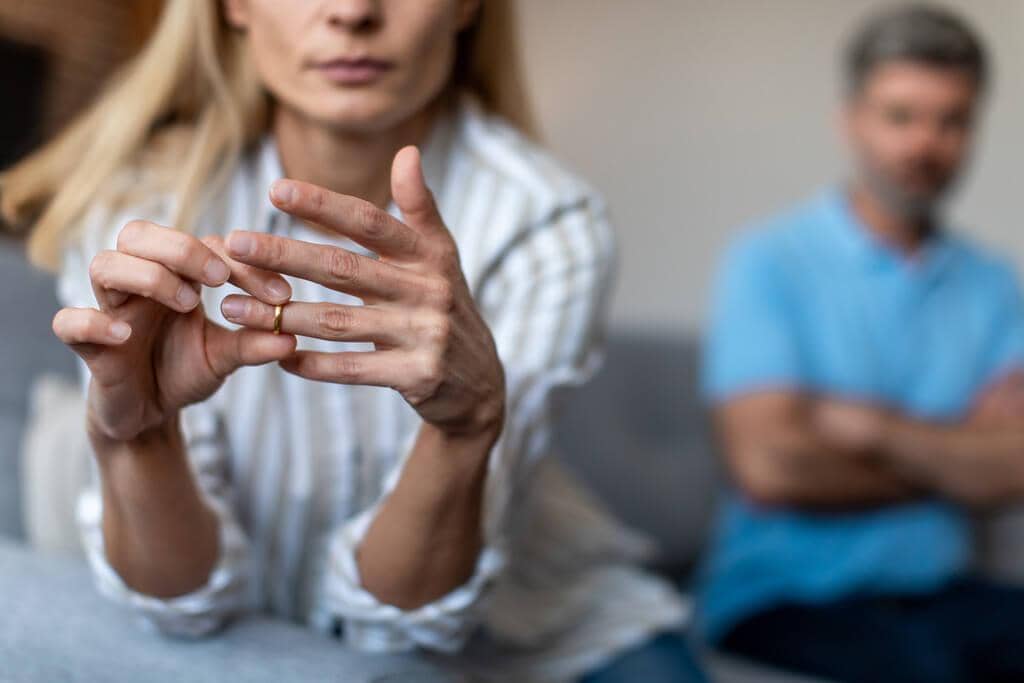 Should You Leave a Marriage With No Intimacy? 10 Essential Questions 4 unhappy middle aged european lady takes ring ignoring man quarrel