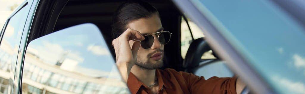 Fragile Masculinity: The Root of Controlling Behavior in Relationships 8 young stylish man trendy accessories posing steering wheel touching sunglasses