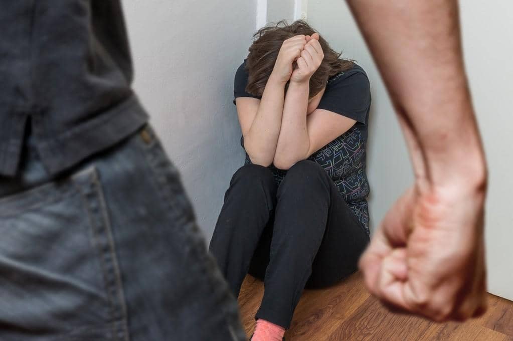 9 Shocking Ways Men Use Anger as Control in Relationships 4 fist of anger man and crying woman sitting in corner domestic violence concept