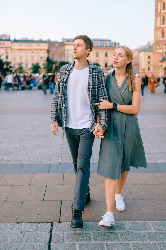 2025’s Most Toxic Dating Trends: Behaviors You Need to Avoid 16 happy loving couple smiling walking throug main square krakow cracow