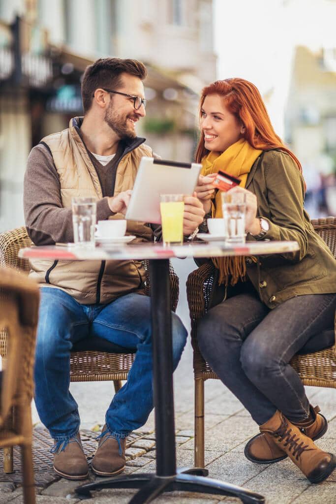 2025’s Most Toxic Dating Trends: Behaviors You Need to Avoid 13 young couple cafe using digital tablet credit card
