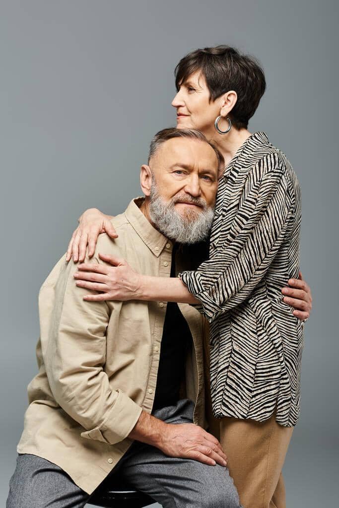 Why Marriage Gets Harder After 50: 9 Unique Challenges 13 middle aged man woman clad stylish attire hug