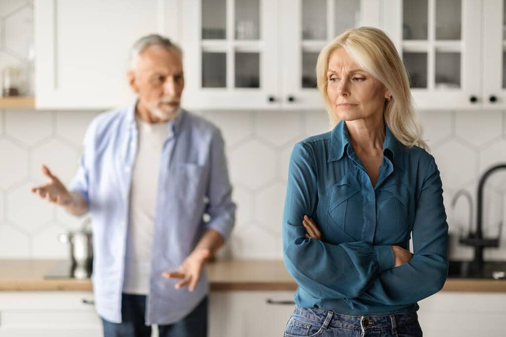Stonewalling vs Silent Treatment: 9 Big Differences to Know 7 relationship crisis portrait senior spouses arguing kitchen interior mature couple