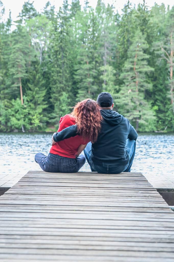 9 Brutally Honest Relationship Questions: Stay or Go 9 guy girl sit hugging pier beautiful lake love