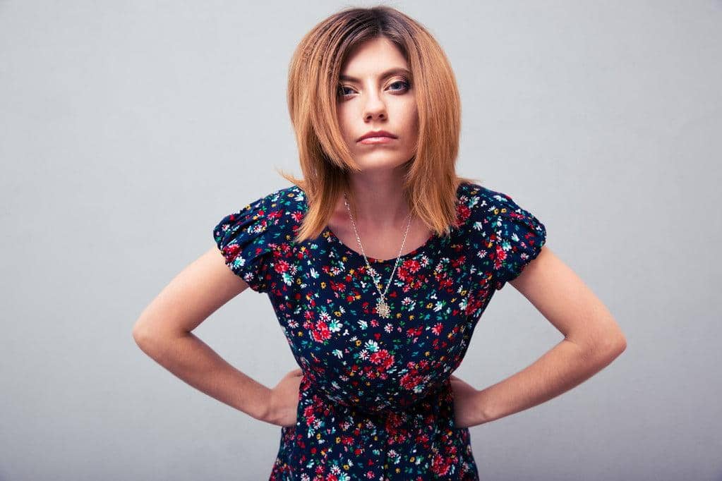 11 Surprising Selfish Things Women Do in Relationships - According to Men 7 Angry woman looking at camera