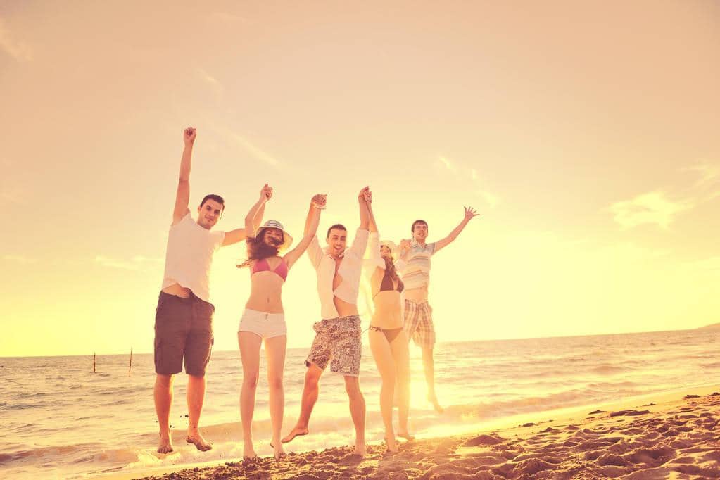 The #1 Brutal Reason for Friendships Ending After Divorce 11 happy young friends group have fun celebrate while jumping running