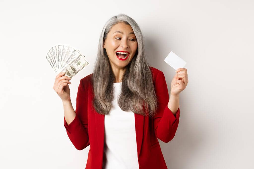 10 Hidden Financial Advantages of Being Single After Divorce 2 senior woman earn money showing dollars in cash