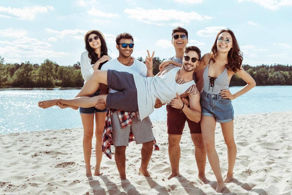 The #1 Brutal Reason for Friendships Ending After Divorce 2 Friends Having Fun Together on the Beach