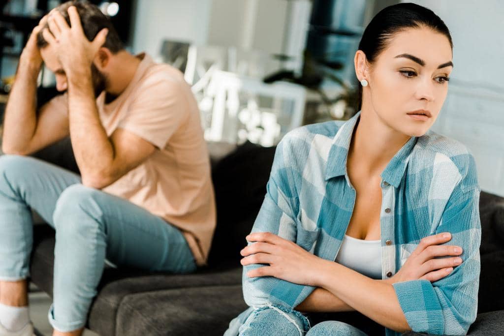 Can't Leave a Failing Marriage? 10 Simple Things to Do 5 upset-couple-sitting-couch-arguing-home