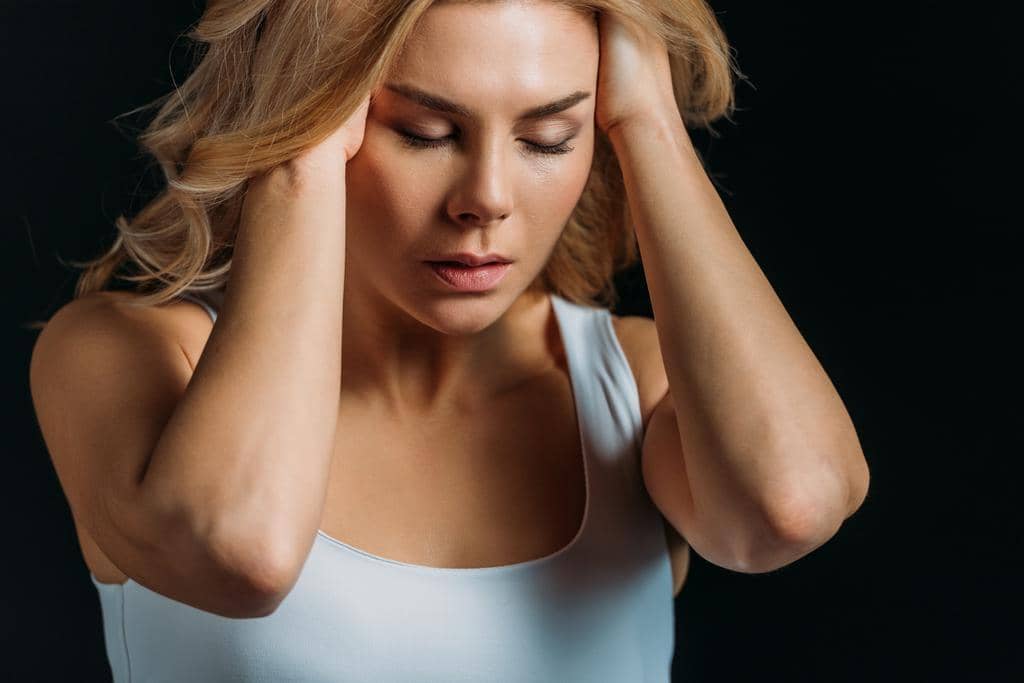 Emotional Toll of Divorce: 7 Things That Push Our Absolute Limits 8 woman closed eyes suffering migraine isolated black