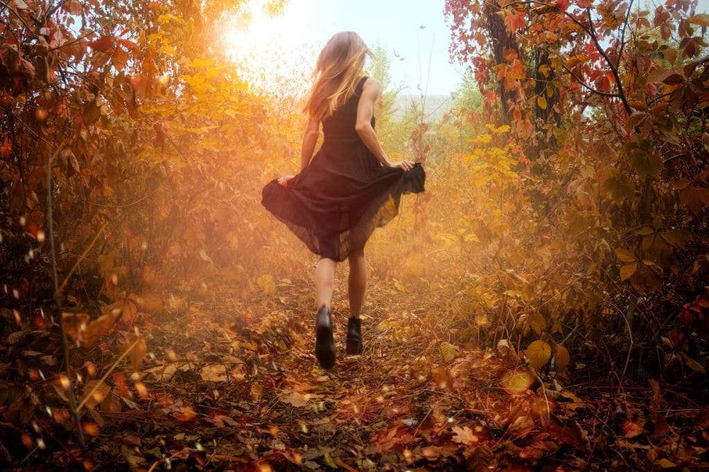 Fantasizing About Living Alone? These 10 Truths Hit Hard 9 girl in black dress running in golden autum forest