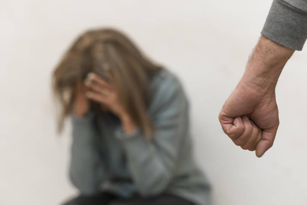 The Link Between Fragile Masculinity and Abuse in Relationships 5 man beating up his wife illustrating domestic violence
