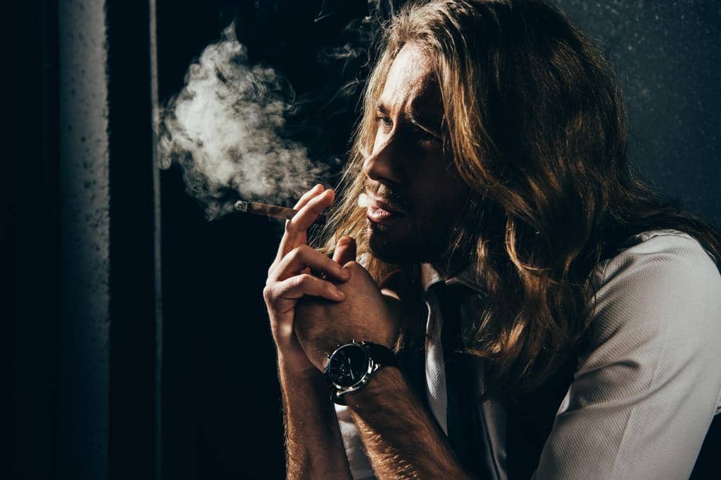 The Link Between Fragile Masculinity and Abuse in Relationships 2 man smoking cigar