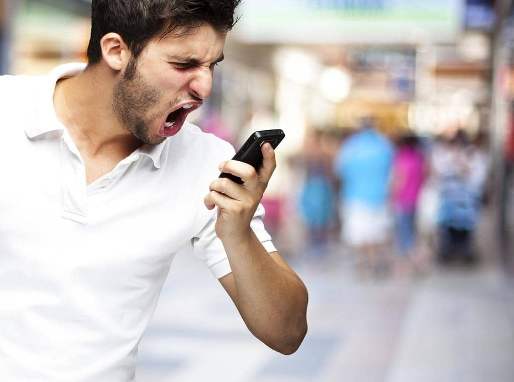 Anger in Marriage: 15 Critical Warnings Your Husband’s Rage Is Tearing You Apart 3 portrait of angry young man shouting using mobile at a crowded m
