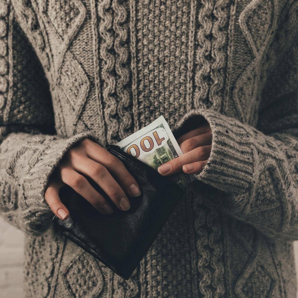 Identity Theft: You Can't Afford to Overlook These 9 Signs 6 woman with money banknote