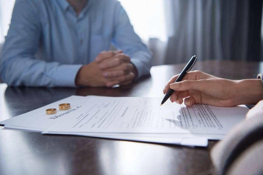 11 Toxic Traits That Signal a Painful Divorce Ahead 3 partial view couple table divorce documents