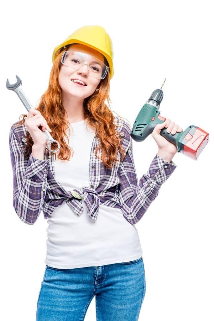 How to Discuss Your Husband's Hygiene Without a Fight 9 vertical portrait of a woman with red hair with tools