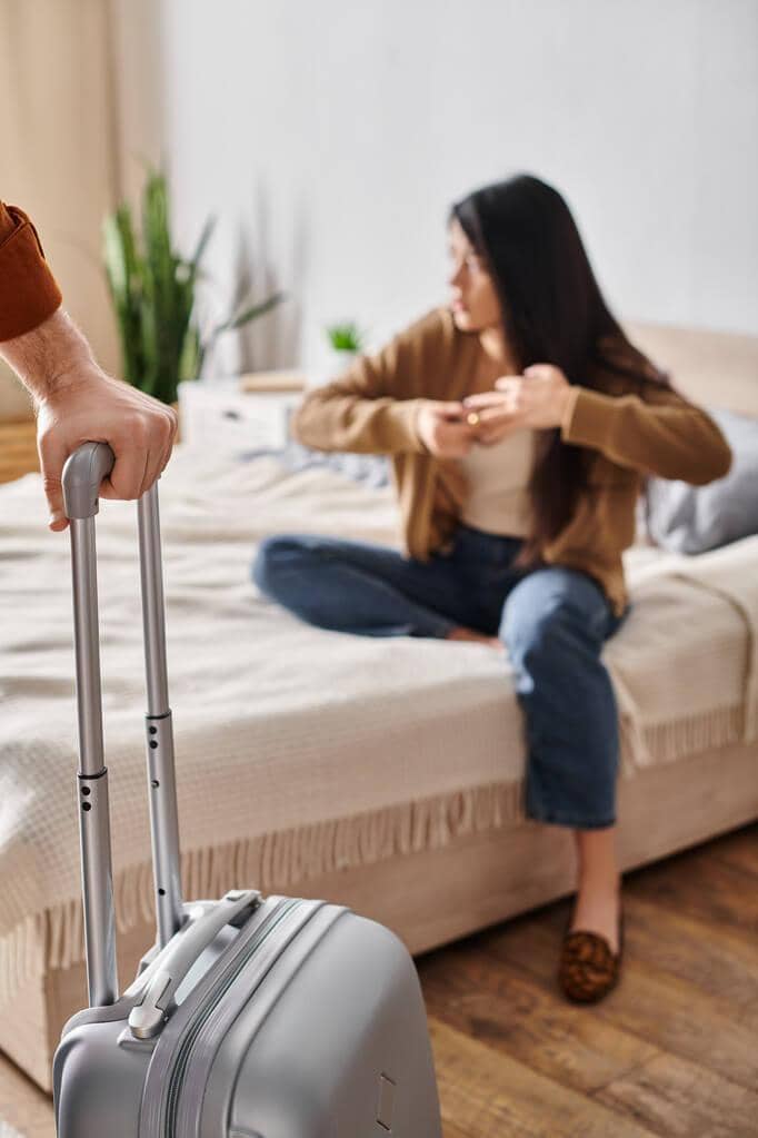 3 Questions Before Leaving a Relationship That Demand Brutal Honesty 9 young gloomy asian woman taking wedding husband suitcase leaving home