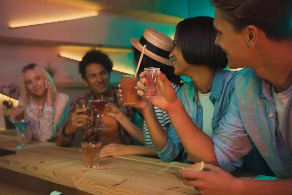 The #1 Brutal Reason for Friendships Ending After Divorce 6 friends drinking cocktails in bar