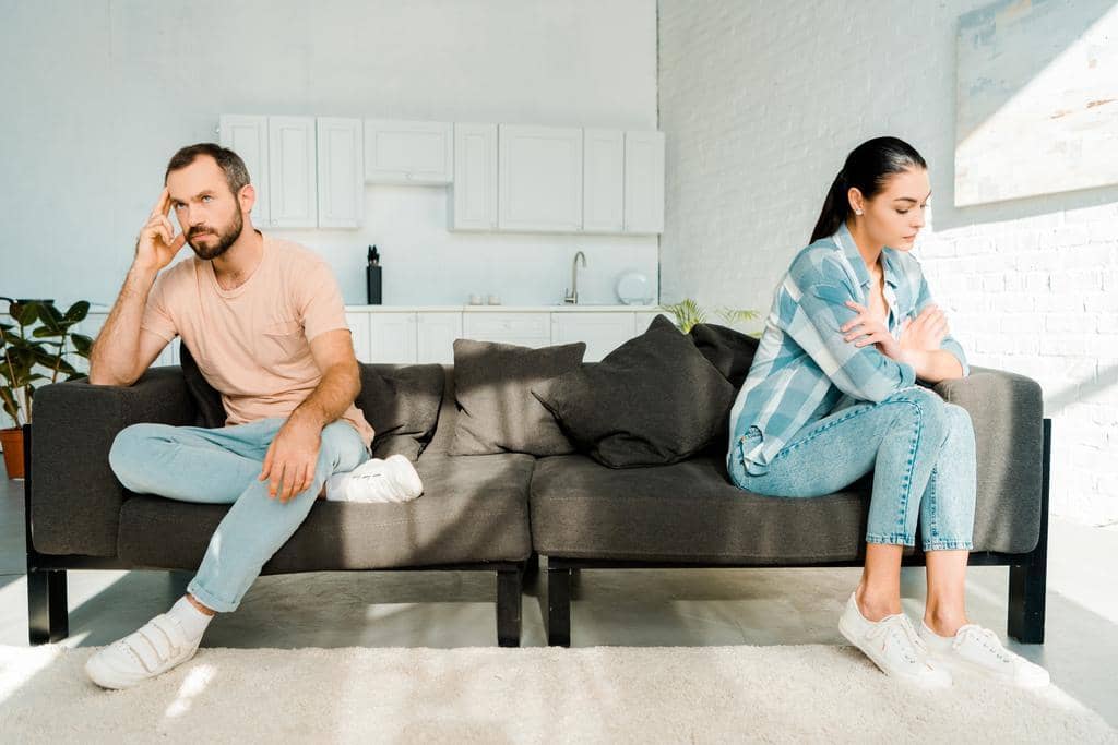9 Reasons Men Settle for Bad Marriages: The Brutal Truth 6 couple having disagreement sitting ends sofa
