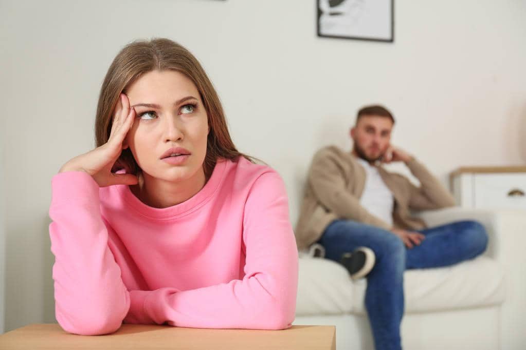 7 Burning Examples of Trauma Adaptation in Relationships 4 young couple ignoring each other argument living room relationship problems