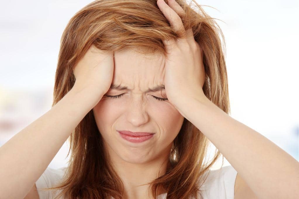 When Your Spouse Won’t Divorce You: 7 Secrets to Freedom 7 tired woman with headache 1