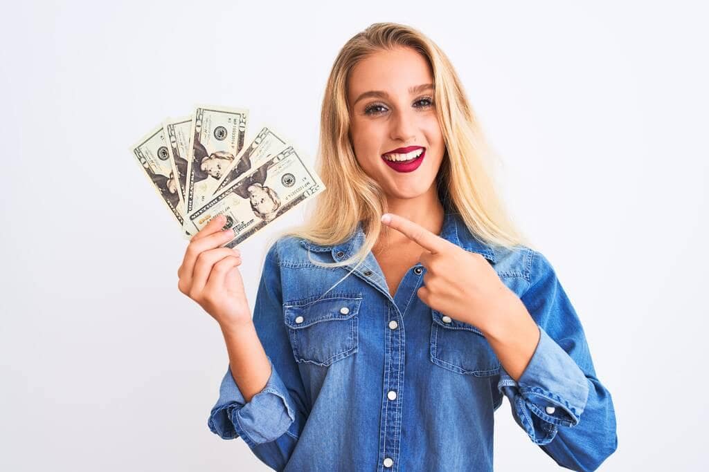 10 Hidden Financial Advantages of Being Single After Divorce 3 blond woman holding dollars standing isolated white background