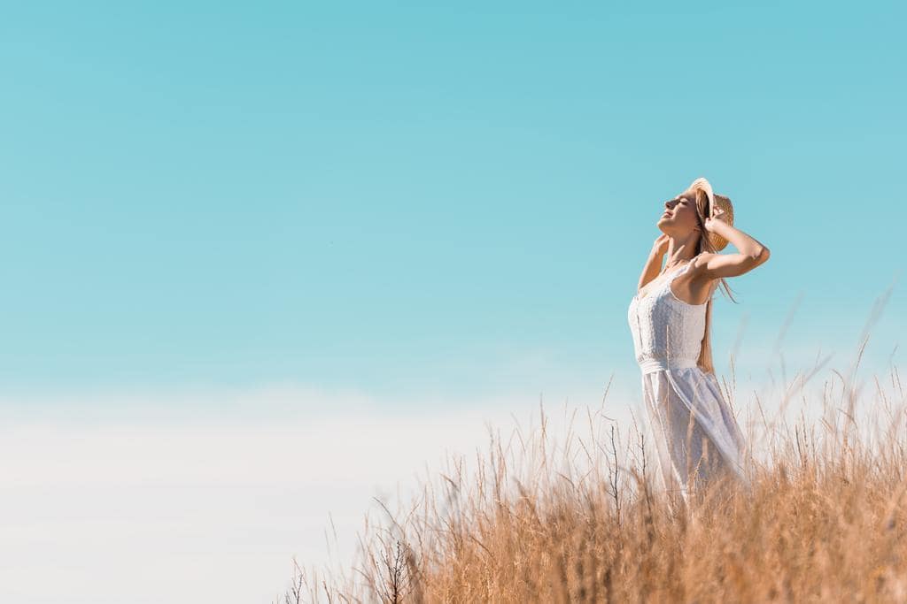 Resentment in Marriage: The 10 Disastrous Root Causes 15 young woman white dress touching straw hat