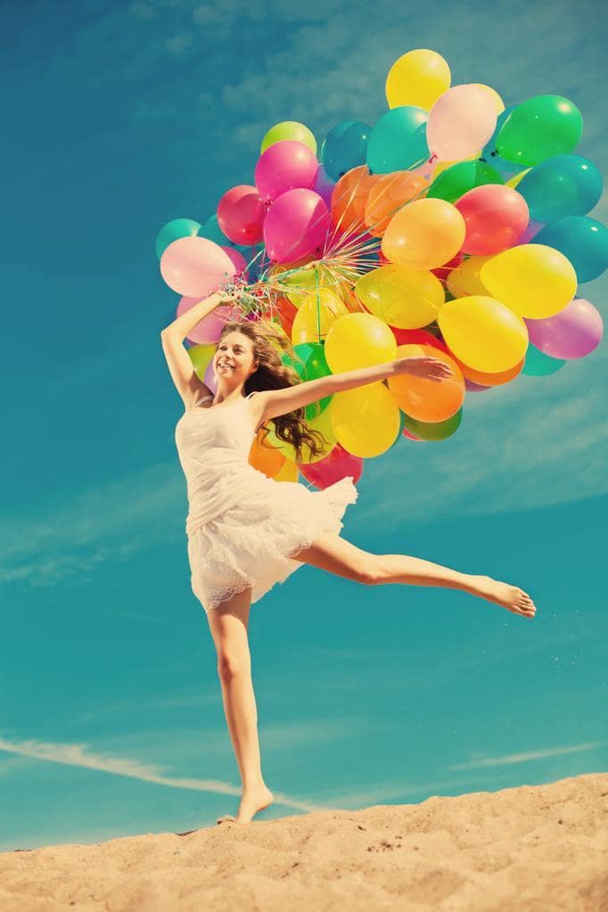 What's Behind the Alarming Decline in Dating Among Women? 11 woman multi colored rainbow balloons hands sky