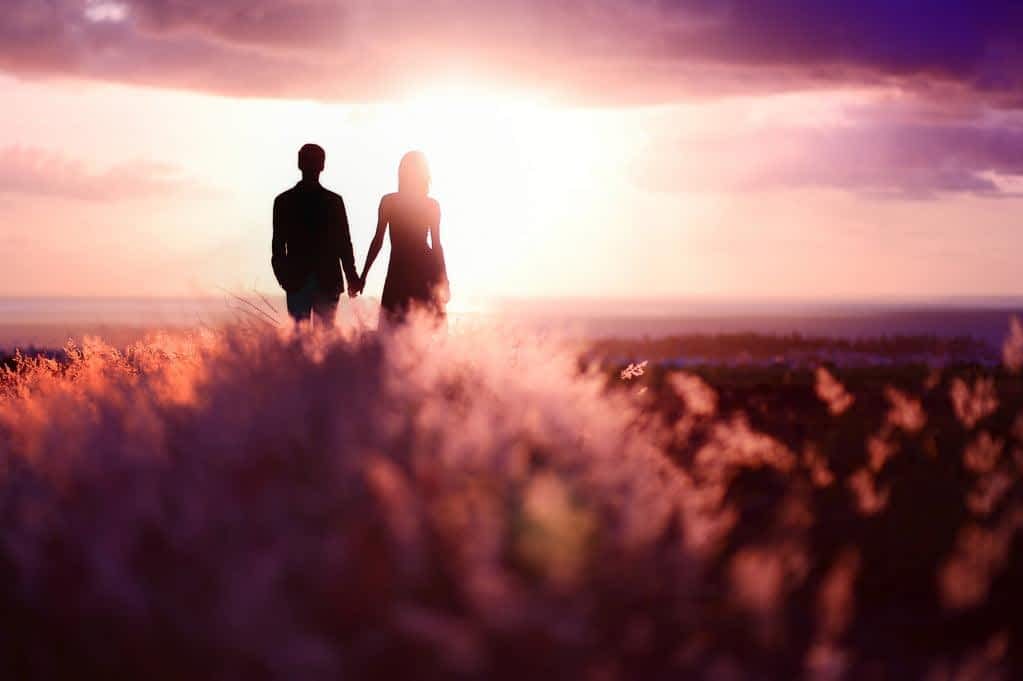 stock photo young couple enjoying the sunset