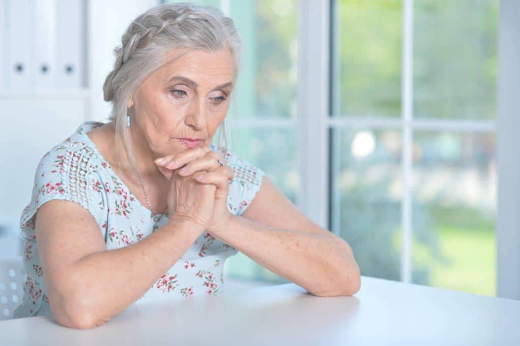 close portrait tired senior woman