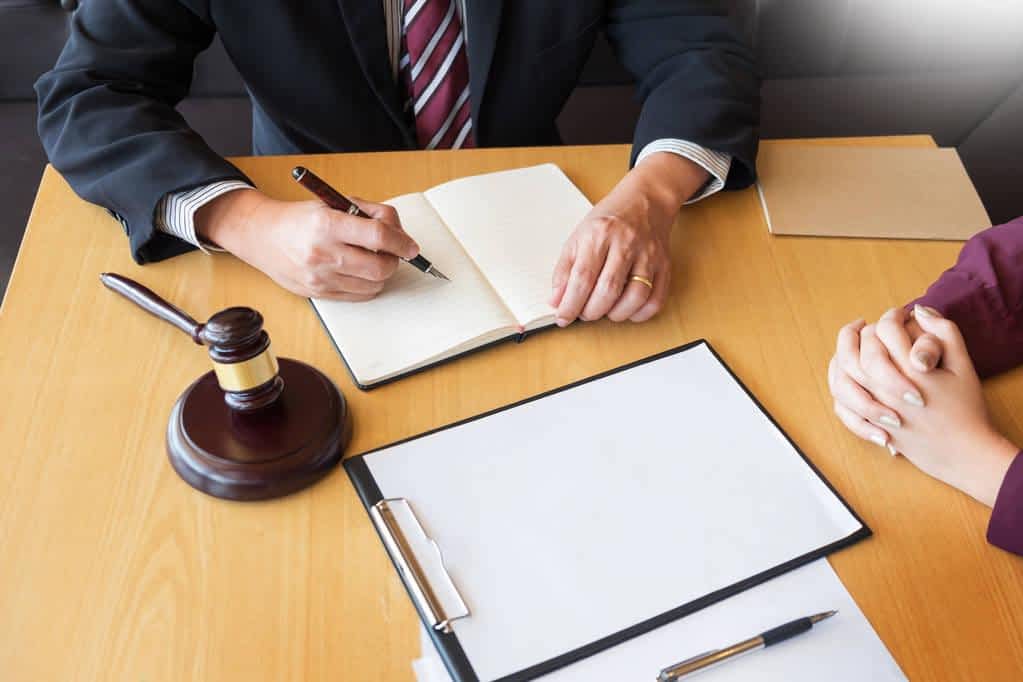 stock photo business people and lawyers discussing contract papers sitting a