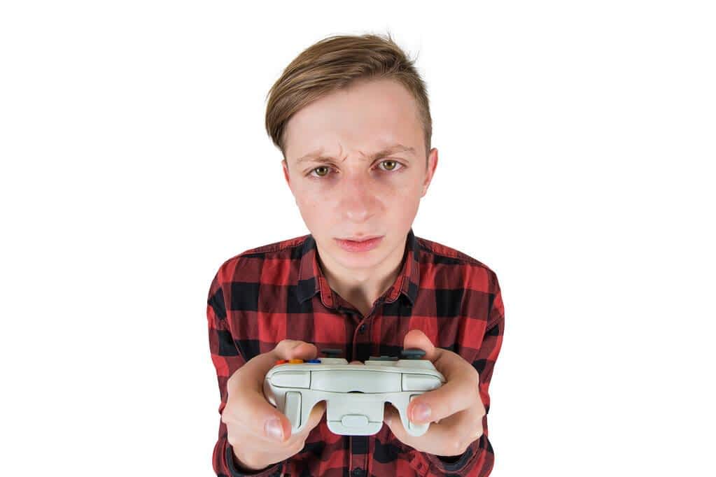 close up portrait of addicted teenage boy has problems due to vi