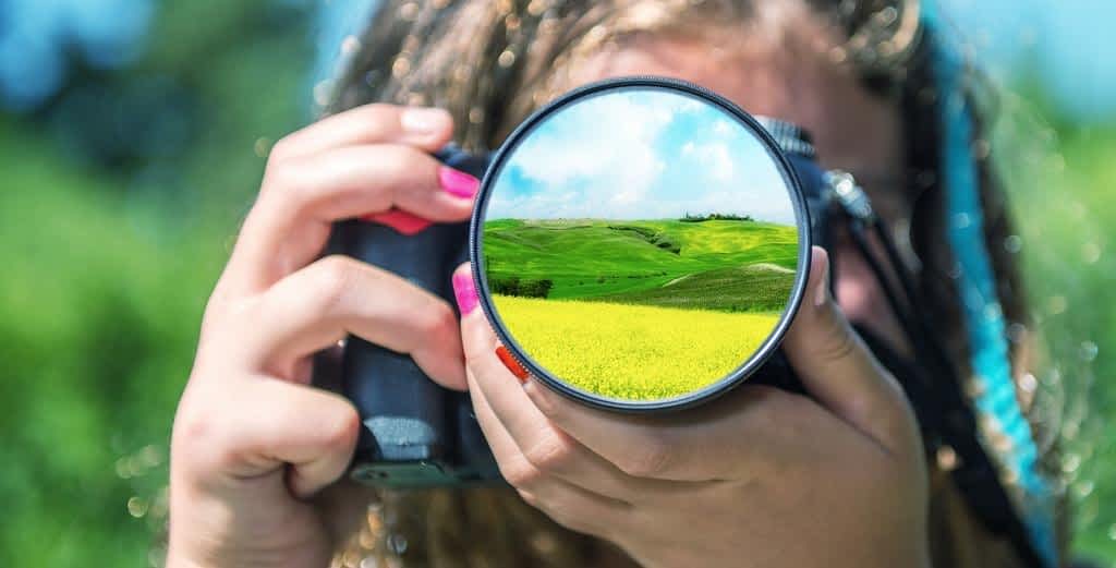 young girl taking photos