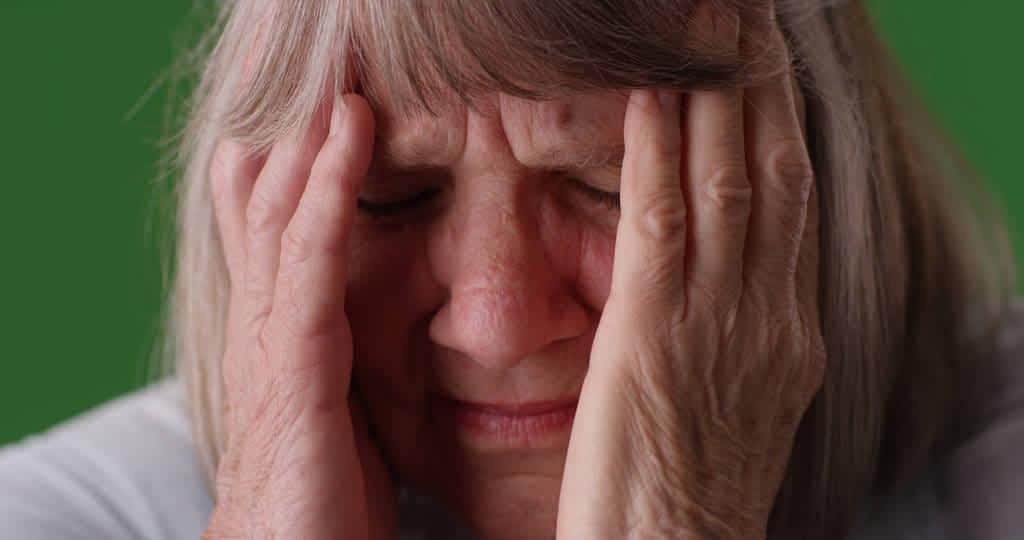 Late Life Divorce: 5 Significant Emotional Survival Challenges 6 closeup senior white lady headache look discomfort green screen