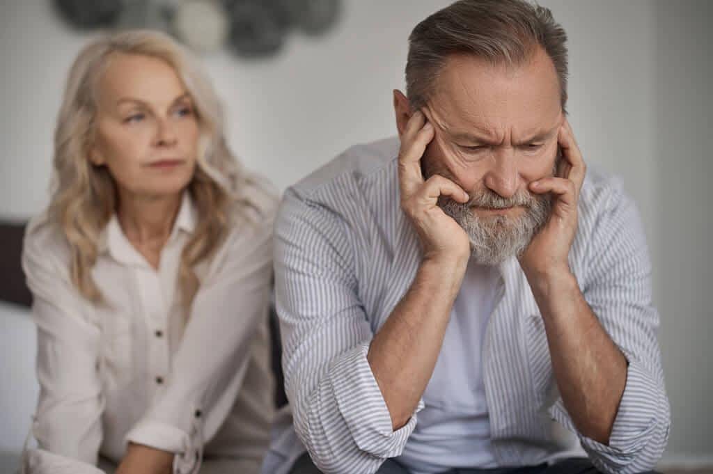 The 7 Mental Struggles of a Dry Marriage 7 Senior Gray couple looking unhappy