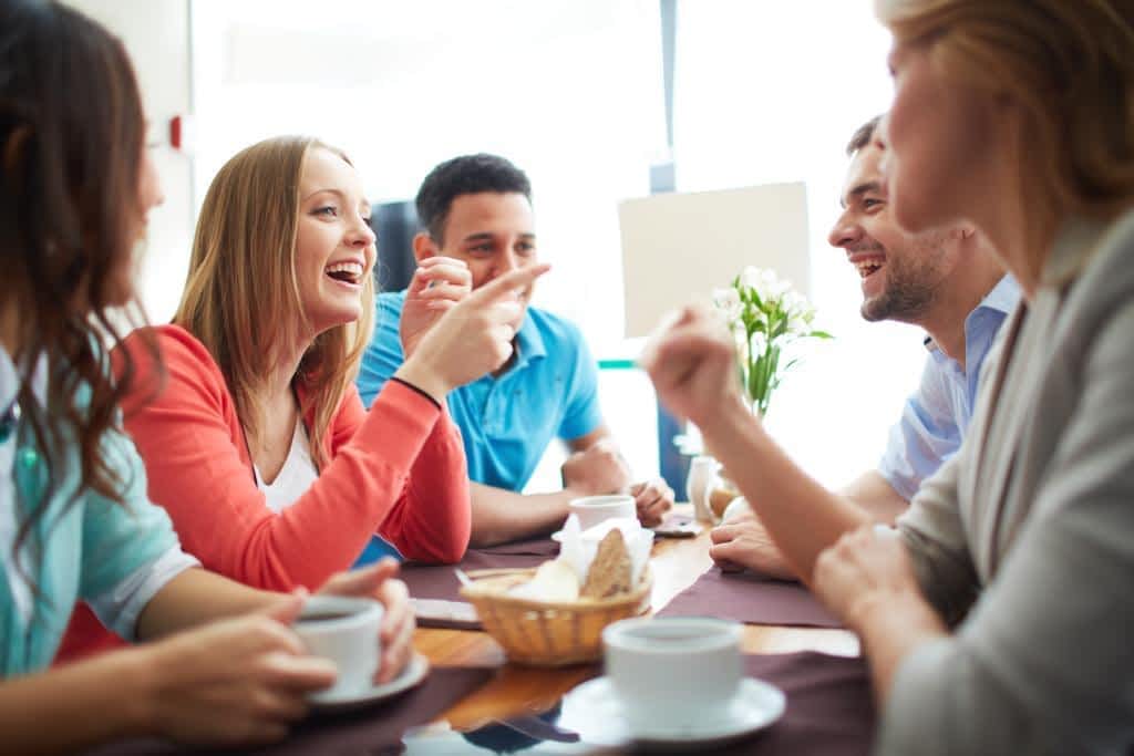friends at a table enjoying a meal together