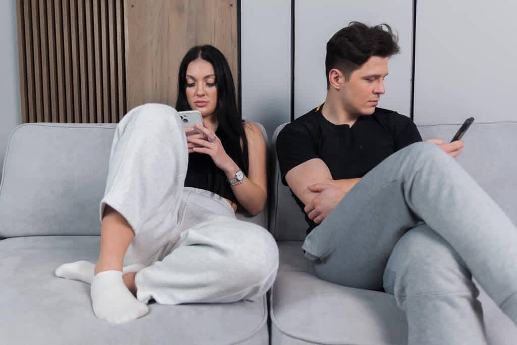 Unhappy couple ignoring each other