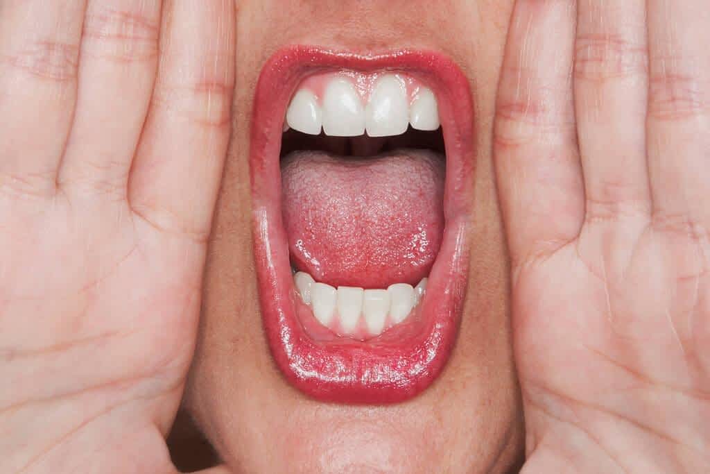 close young woman red lips