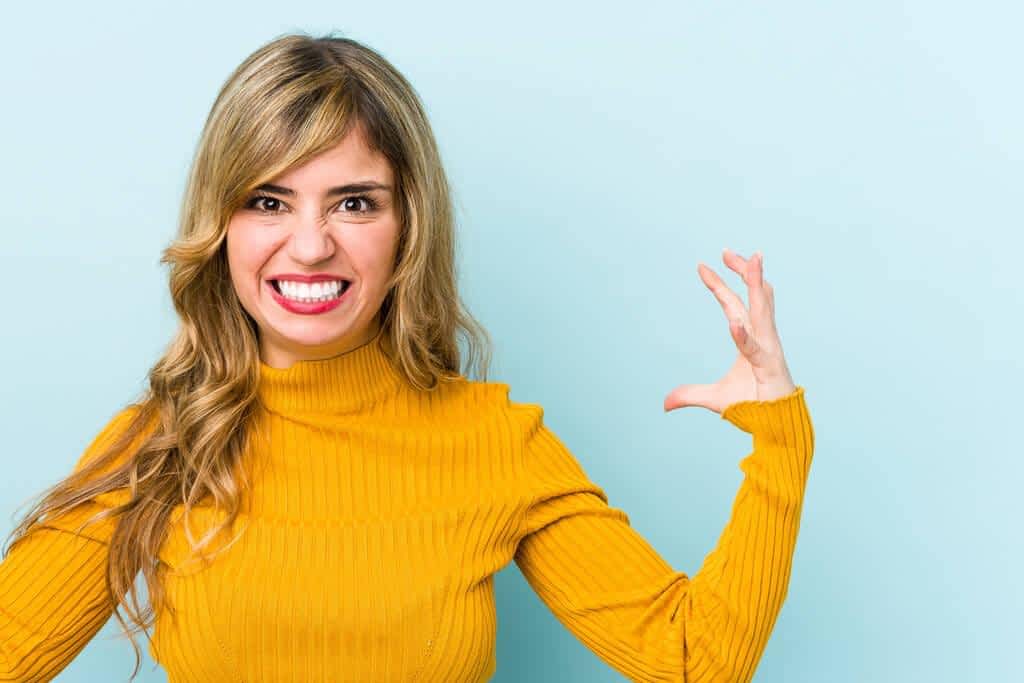 young blonde caucasian woman screaming rage