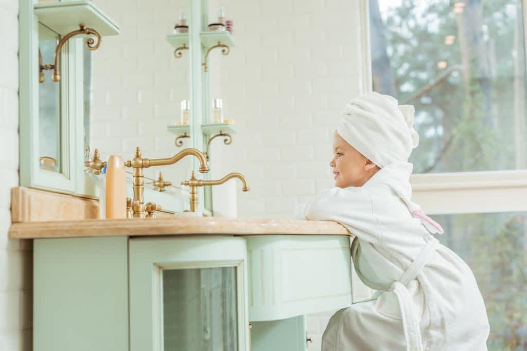 15 Damaging Parenting Mistakes That Create Narcissism in Children 8 child in bathrobe and towel on head