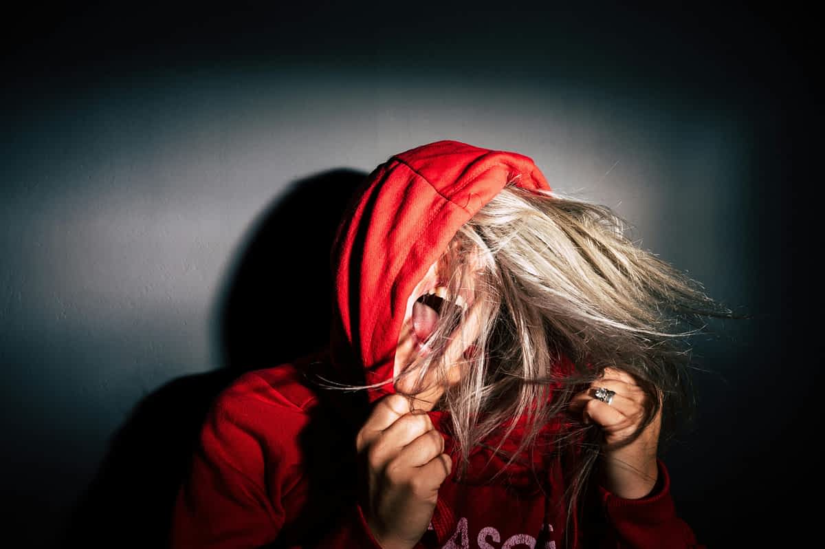 screaming angry woman in red hoodie