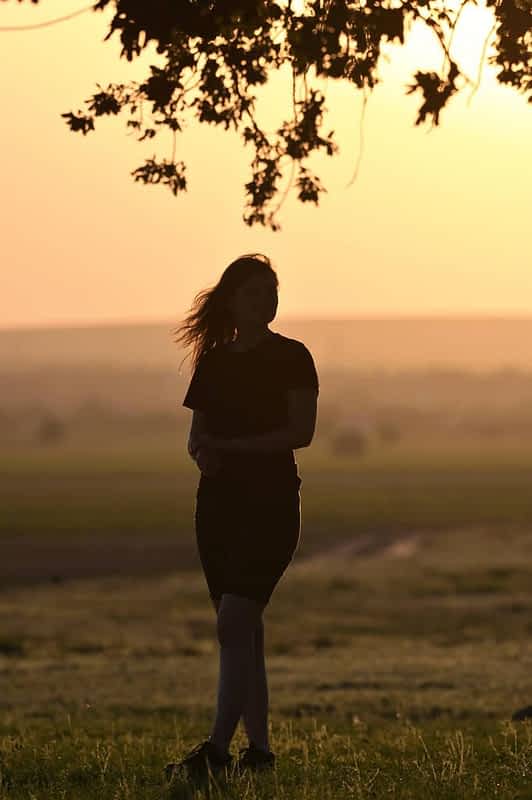 portrait young woman silhouette sunset