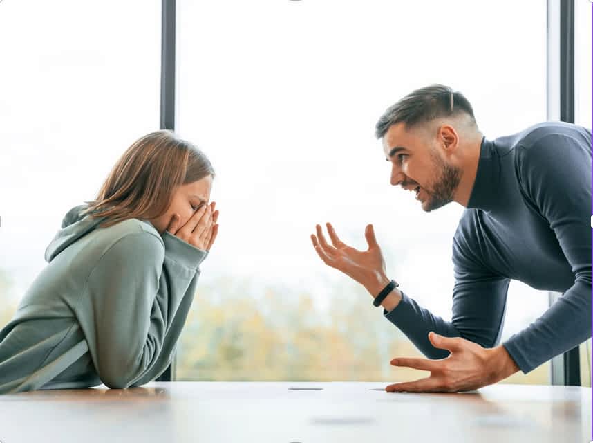 angry man yelling at woman