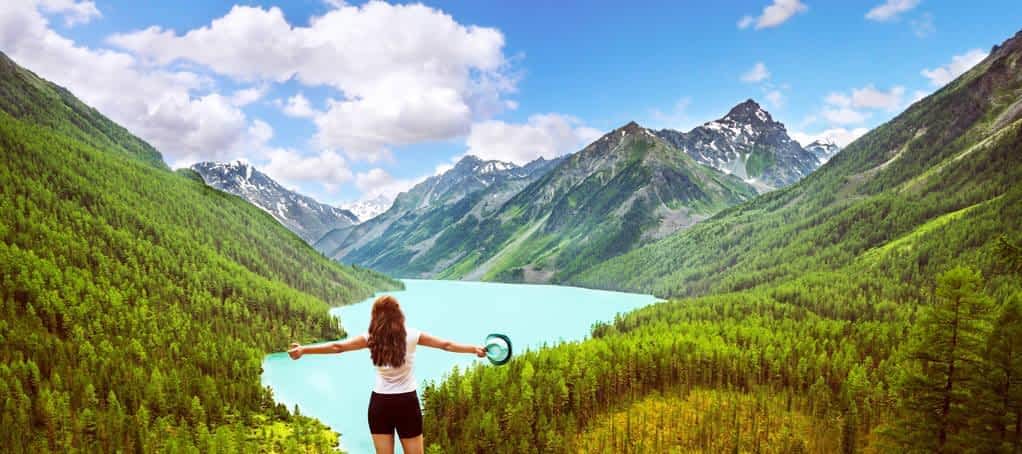 freedom concept beauty girl in mountains on background view