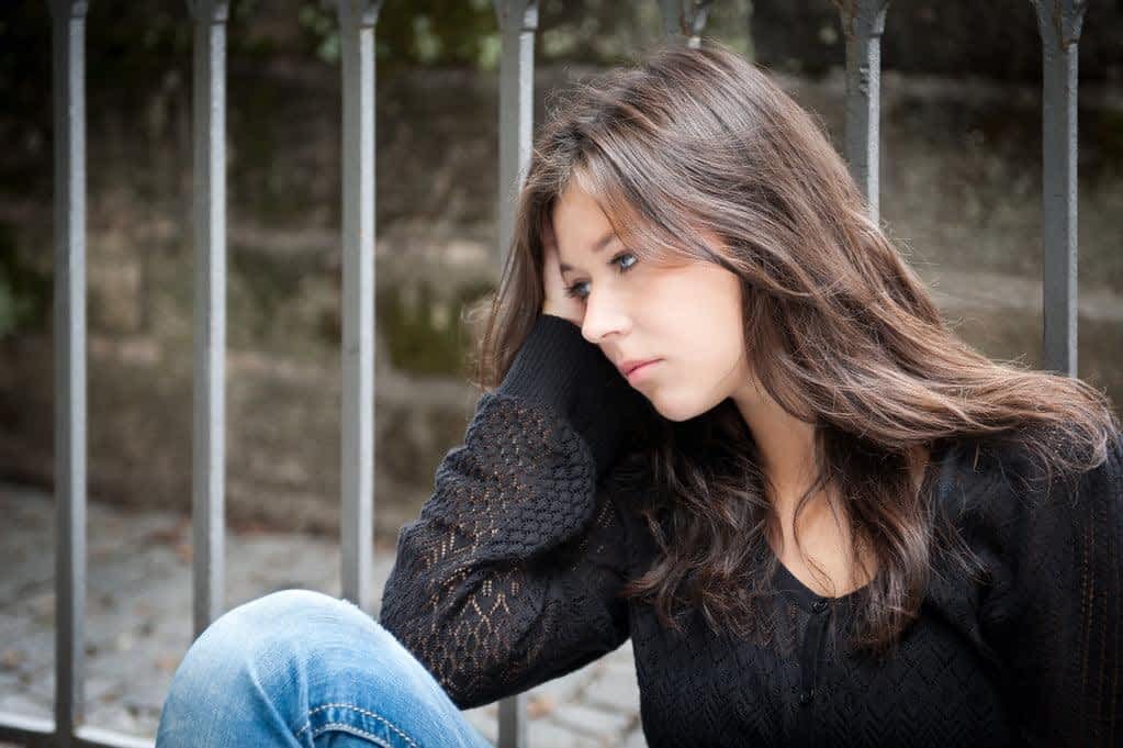 stock photo teenage girl looking thoughtful about troubles