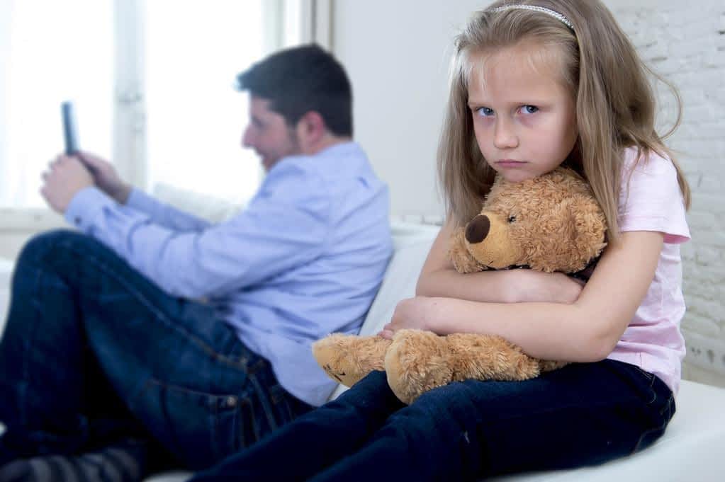 internet addict father ignoring little sad daughter