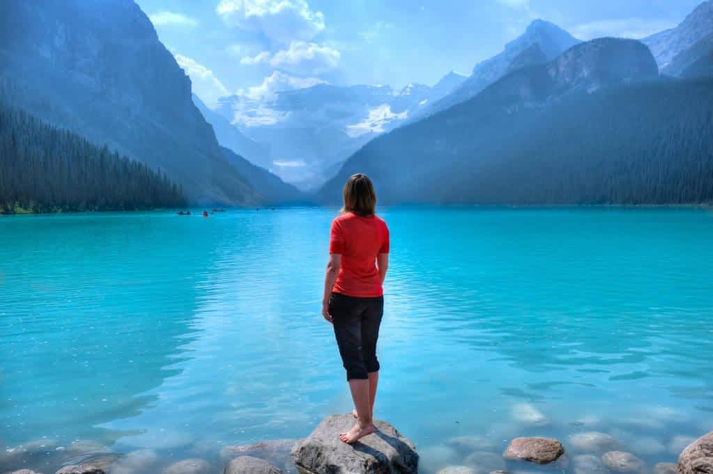woman alone lake louise shore